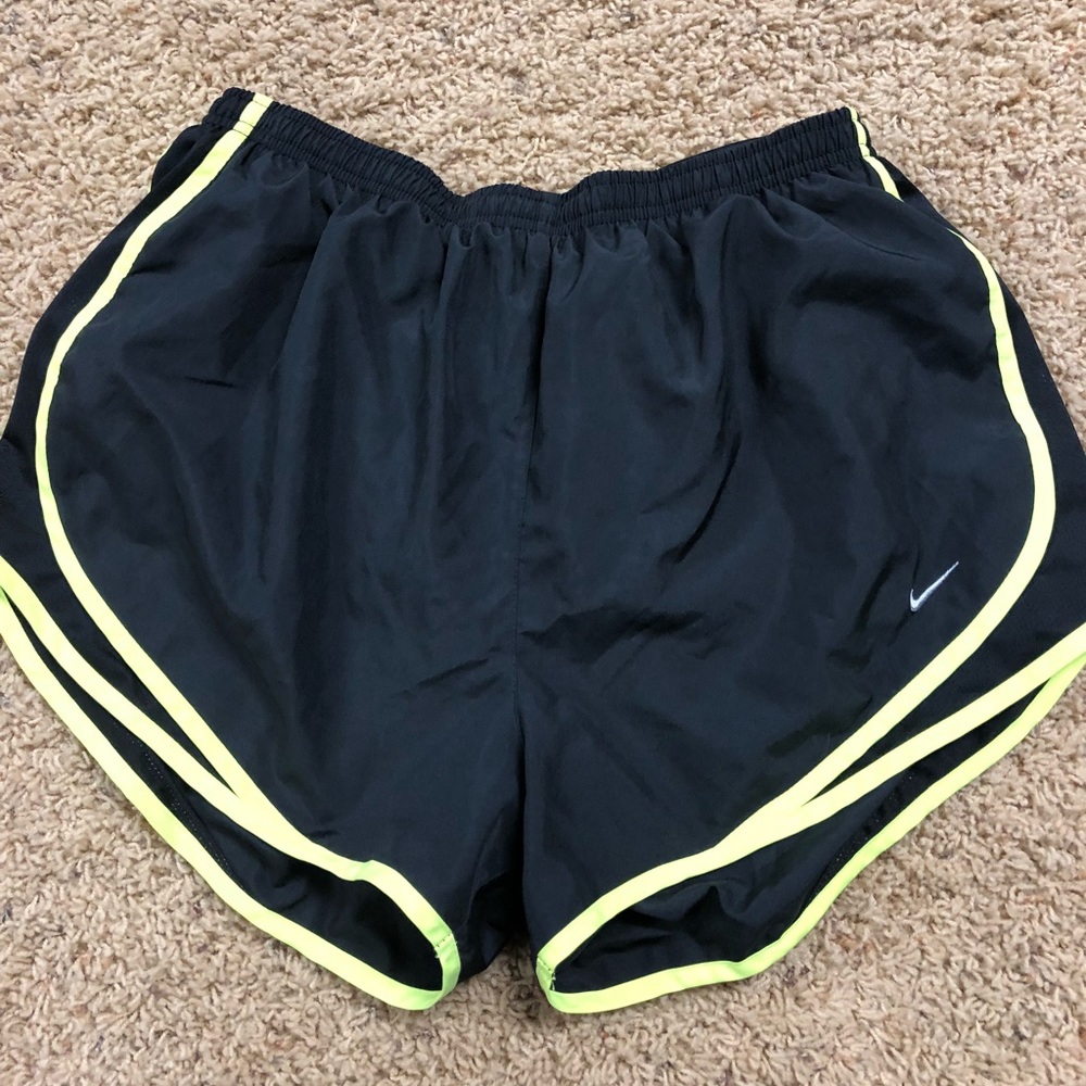 Black and yellow Nike running shorts